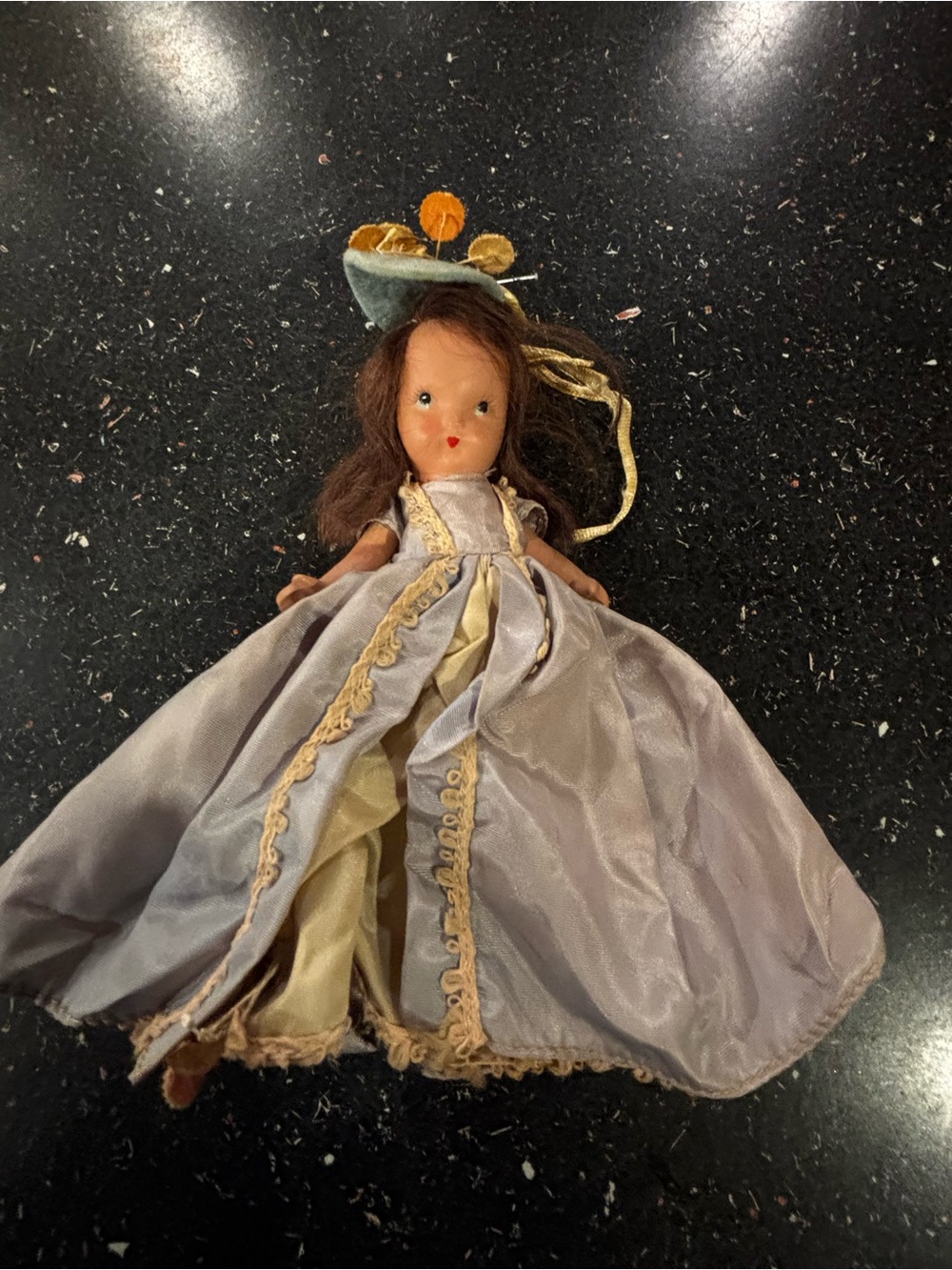 Vintage NaPorcelain Doll in Pale blue and Gold Gown labeled “Storybook doll